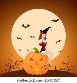 Beautiful red-haired PinUp witch on pumpkin at the background of the cemetery