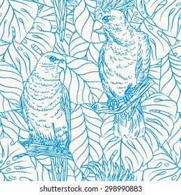 Beautiful seamless background with blue parrots and palm leaves