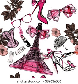 Beautiful seamless fashion background with perfume Eifel tower shoes sandals flowers and lipstick