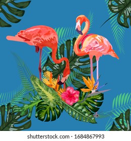 Beautiful seamless floral pattern background with pink flamingos, tropical flowers.