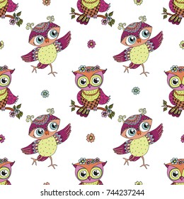 Beautiful seamless pattern of cute colorful cartoon owls with flowers. Lovely illustration of birds on white background.