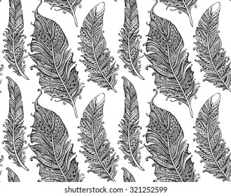 Beautiful seamless pattern with hand drawn stylized feathers in doodle style. Monochrome vector endless background