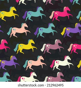 Beautiful seamless pattern with horse silhouettes. Perfect dressage event texture made in orange, yellow and blue colors on beige background. Animal texture drawn in vector.