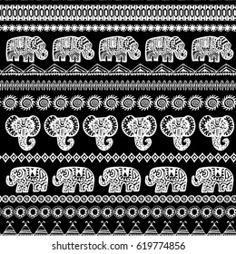 Beautiful seamless pattern Indian Elephant with ornamental strips. Hand drawn ethnic tribal decorated Elephant. White contour on Black background. for site, blog, fabric. Vector illustration