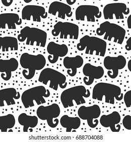 Beautiful seamless pattern Indian Elephant with polka dot ornaments. Hand drawn ethnic tribal decorated animals. black contour isolated on white endless background. Vector illustration
