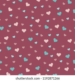 beautiful seamless pattern with on a pink background with hearts multicolored for the holiday of St. Valentine's Day