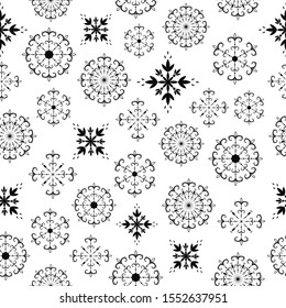 Beautiful seamless pattern with openwork vector snowflakes. Decorative hand drawn pattern for design on a white background