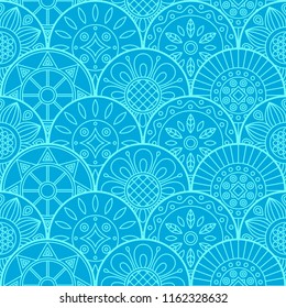 Beautiful seamless pattern with round elements in the form of mandalas. Blue vector background.