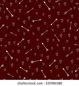 Beautiful seamless pattern with white hearts and arrows on red background. Happy Valentine's Day.