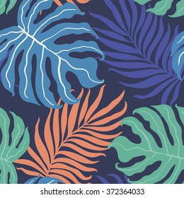 Beautiful seamless tropical jungle floral pattern background with palm leaves