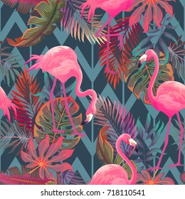 Beautiful seamless vector tropical pattern with pink flamingo and palm leaves on geometric background. Abstract summer texture