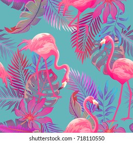 Beautiful seamless vector tropical pattern with pink flamingo and palm leaves on blue background. Abstract summer texture