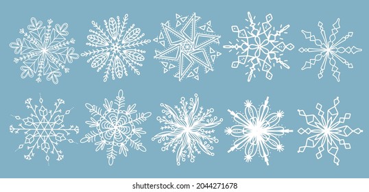 Beautiful set white snowflakes on a blue background for winter design. Collection of Christmas New Year elements. Frozen silhouettes of crystal snowflakes. Modern design apartment. Holiday wallpapers.