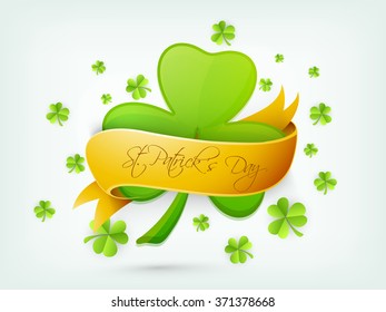 Beautiful Shamrock Leaf covered by glossy golden ribbon for Happy St. Patrick's Day celebration.