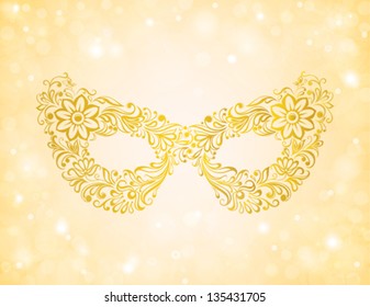 beautiful silhouette golden mask on the background sparkles and bokeh. Many similarities to the author's profile