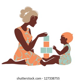 Beautiful silhouette  of mother and baby playing with toys. Happy Mother's Day