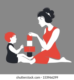 Beautiful silhouette  of mother and baby playing with toys. Happy Mother's Day