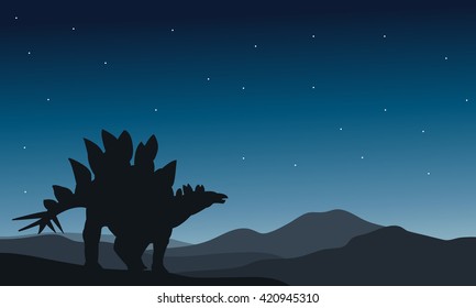 Beautiful silhouette stegosaurus at the night in hills