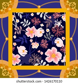 Beautiful silk scarf with golden chains and flowers. Colorful vitnage composition with plants and jewelry elements. On blue background.