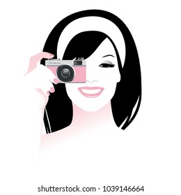 Beautiful smiling girl holding a retro photo camera, vintage style