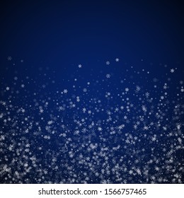 Beautiful snowfall Christmas background. Subtle flying snow flakes and stars on dark blue night background. Alluring winter silver snowflake overlay template. Ecstatic vector illustration.