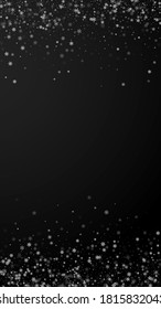 Beautiful snowfall Christmas background. Subtle flying snow flakes and stars on black background. Admirable winter silver snowflake overlay template. Precious vertical illustration.