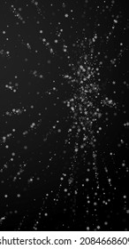 Beautiful snowfall Christmas background. Subtle flying snow flakes and stars on black background. Adorable winter silver snowflake overlay template. Mind-blowing vertical illustration.