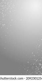 Beautiful snowfall Christmas background. Subtle flying snow flakes and stars on grey background. Adorable winter silver snowflake overlay template. Cute vertical illustration.