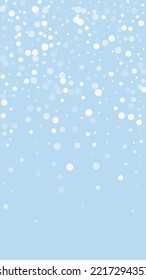 Beautiful snowfall christmas background. Subtle flying snow flakes and stars on light blue winter backdrop. Beautiful snowfall overlay template. Vertical vector illustration.