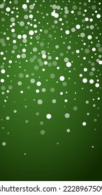 Beautiful snowfall christmas background. Subtle flying snow flakes and stars on christmas green background. Beautiful snowfall overlay template. Vertical vector illustration.