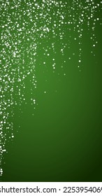 Beautiful snowfall christmas background. Subtle flying snow flakes and stars on christmas green background. Beautiful snowfall overlay template. Vertical vector illustration.