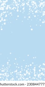 Beautiful snowfall christmas background. Subtle flying snow flakes and stars on light blue winter backdrop. Beautiful snowfall overlay template. Vertical vector illustration.