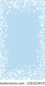 Beautiful snowfall christmas background. Subtle flying snow flakes and stars on light blue winter backdrop. Beautiful snowfall overlay template. Vertical vector illustration.