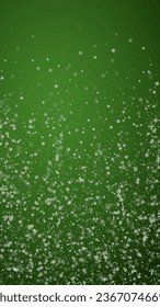 Beautiful snowfall christmas background. Subtle flying snow flakes and stars on christmas green background. Beautiful snowfall overlay template. Vertical vector illustration.