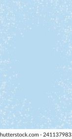 Beautiful snowfall christmas background. Subtle flying snow flakes and stars on light blue winter backdrop. Beautiful snowfall overlay template. Vertical vector illustration.