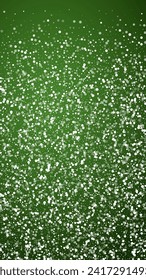 Beautiful snowfall christmas background. Subtle flying snow flakes and stars on christmas green background. Beautiful snowfall overlay template. Vertical vector illustration.