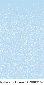Beautiful snowfall christmas background. Subtle flying snow flakes and stars on light blue winter backdrop. Beautiful snowfall overlay template. Vertical vector illustration.