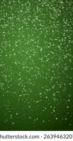 Beautiful snowfall christmas background. Subtle flying snow flakes and stars on christmas green background. Beautiful snowfall overlay template. Vertical vector illustration.
