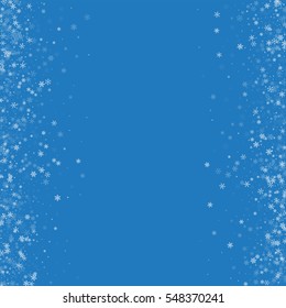 Beautiful snowfall. Messy border with beautiful snowfall on blue background. Vector illustration.