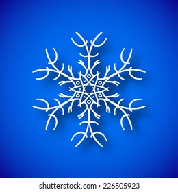 Beautiful snowflake with shadow on blue background