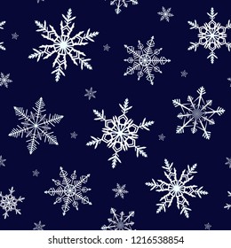 Beautiful snowflakes seamless pattern on dark blue background