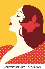 Beautiful spanish woman with flower in her hair and polka dot dress wearing big circular earrings