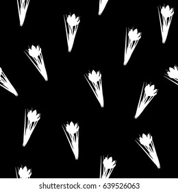 Beautiful spring seamless pattern with crocuses. Black and white flowers same sizes of small saffron on black background. Vector