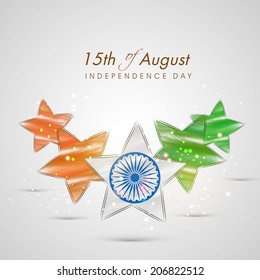 Beautiful stars in national tricolors with Ashoka Wheel on shiny grey background for 15th of August Indian Independence Day celebrations. 