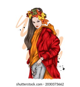 Beautiful stylish girl in stylish clothes and a wreath of autumn leaves. Fashion and style, clothing and accessories. Autumn.