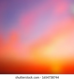 Beautiful summer sunset, violet and pale violet-red stripes at the top, and the transition from yellow and orange to titanium, blur, sky, sun, gradient. Suitable as a background for any of your design