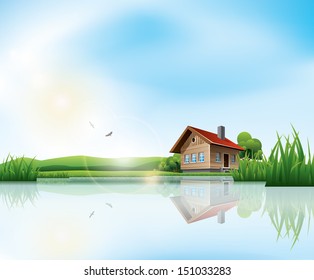 Beautiful sunny landscape with house and a lake