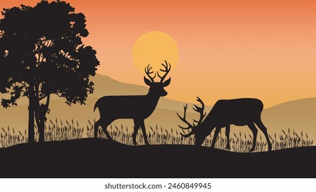 Beautiful sunset background with deer silhouettes