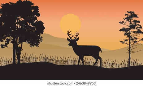 Beautiful sunset background with deer silhouettes