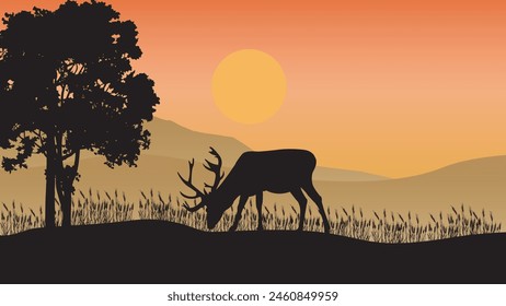 Beautiful sunset background with deer silhouettes